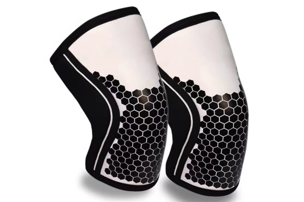Custom neoprene knee sleeves with gradient two-tone panels and hex pattern