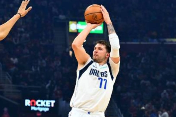 Close-up of a basketball shooting arm sleeve during a jump shot follow-through