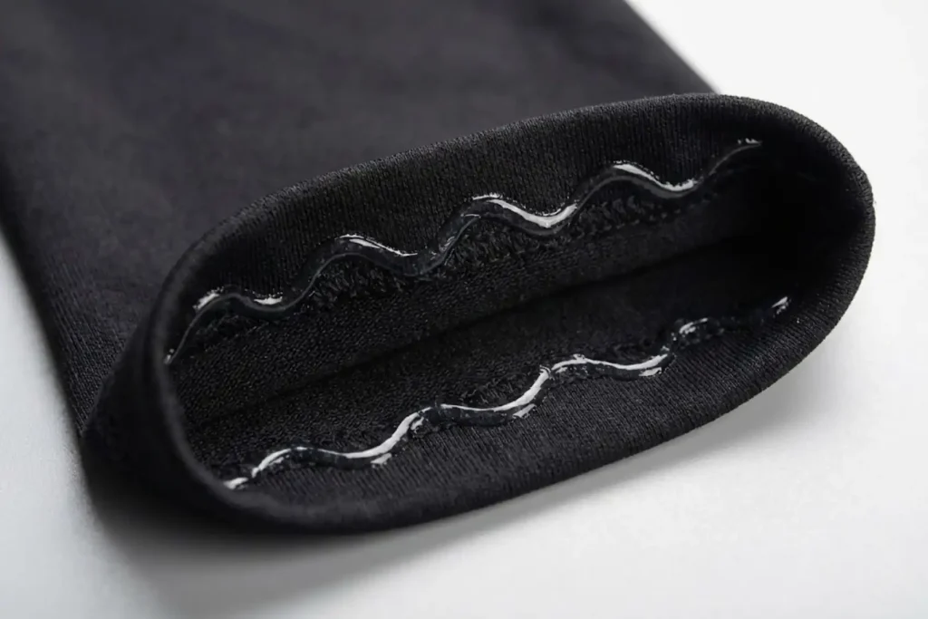 Close-up view of a wavy silicone anti-slip grip band inside an arm sleeve cuff