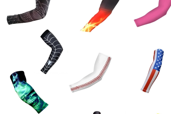 Different types of arm sleeves laid out for athletes to choose