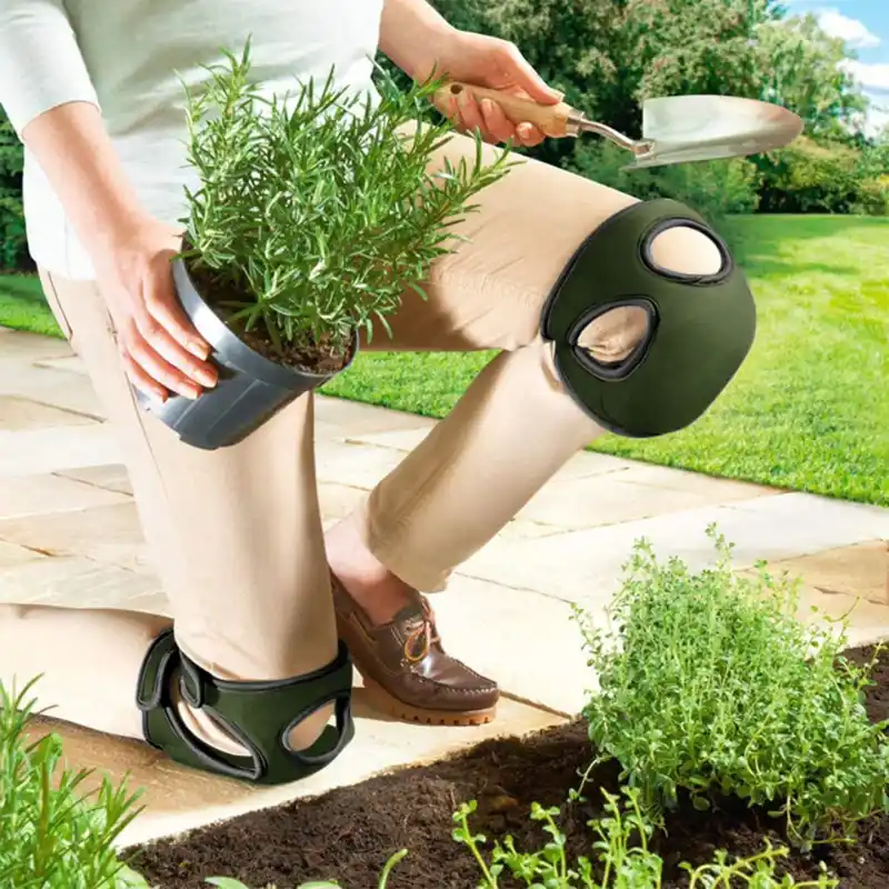 Gardening knee sleeves used by a gardener kneeling on soil while planting