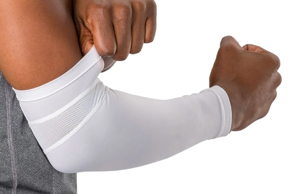 Loose arm sleeve showing wrinkles, bunching, and sliding during movement