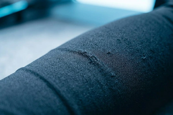 Macro shot of gaming sleeve fabric showing usage wear and durability