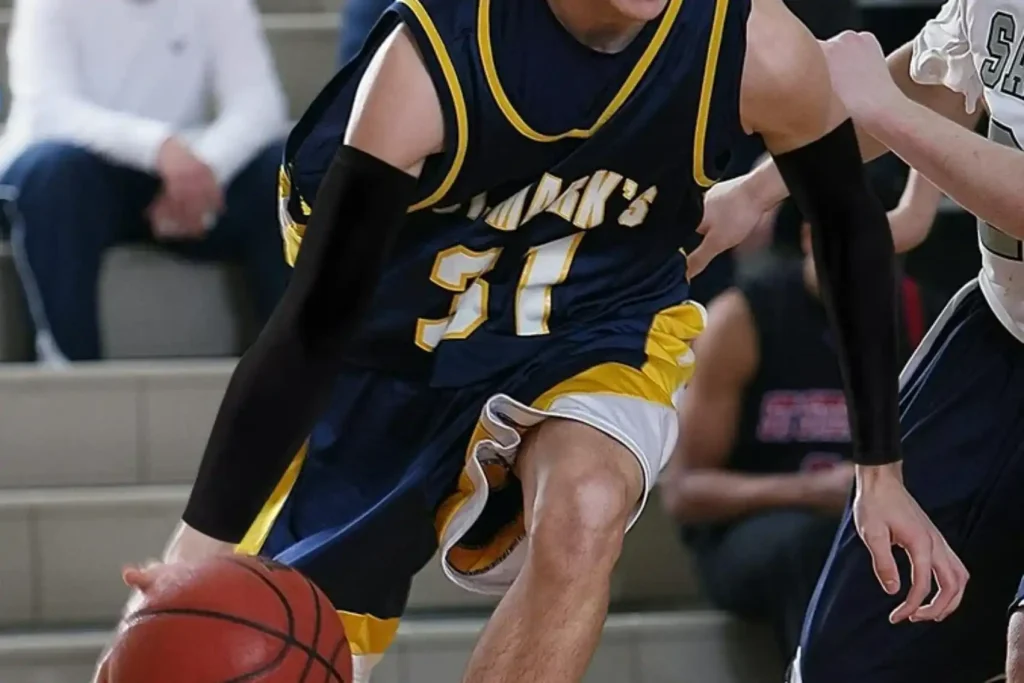 Rule-safe solid color basketball arm sleeves in black, white, and beige for high school game compliance