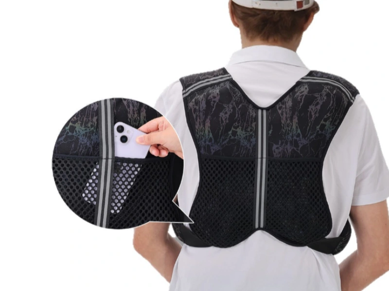 Weighted vest storage mesh pocket holding a smartphone